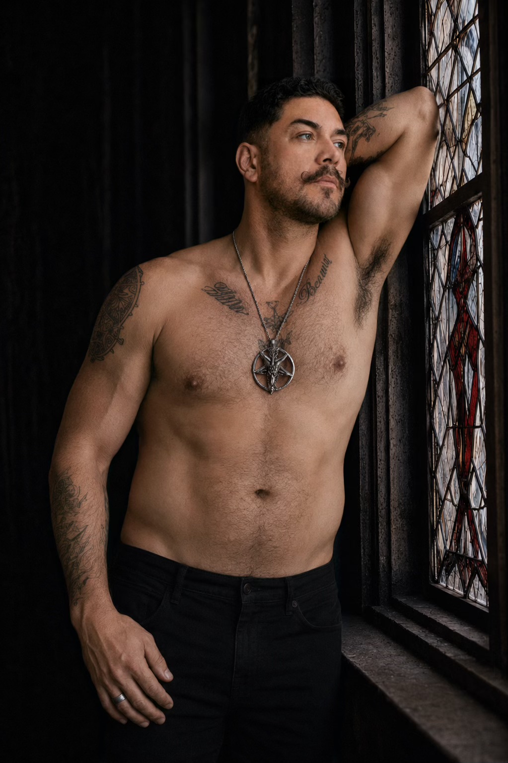 Angelo Noctis Corvus, creator of Michael Horrorz, beside a gothic stained-glass window